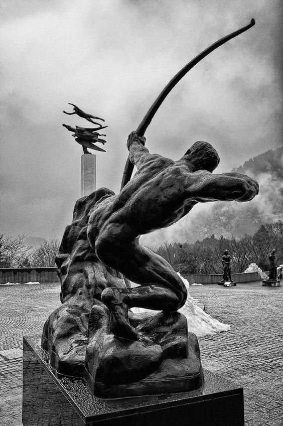Statue of an archer drawing a bow